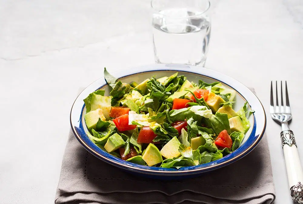 Healthy avocado spinach tomato salad